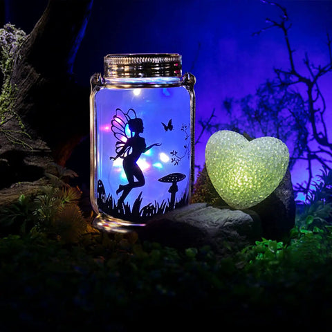 2 Pack Solar Fairy Lanterns For Garden Decor Hanging Glass Jar Mason Lanterns With Warm LED Light Cozy Whimsical Outdoor Yard Patio Lawn Party Lighting Best Gift For Mom Grandma Women On Mothers Day featuring frosted jar with fairy silhouette and glowing heart.