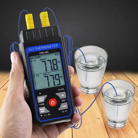 Dual Channel K And J Type Thermocouple Thermometer With Alarm And Compensation Adjustment held over glasses of water