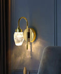 Modern Double Head LED Wall Sconce Rock Solid Hardware Body and Prismatic Crystal Details. Gold finish with crystal shade, perfect for bedroom.