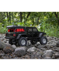 SCX24 Jeep Gladiator One Twenty Fourth Scale 4x4 Rock Crawler Ready To Run Brushed RC Car on rocky terrain