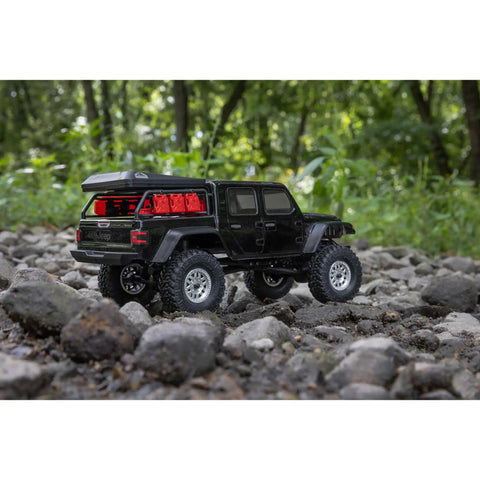 SCX24 Jeep Gladiator One Twenty Fourth Scale 4x4 Rock Crawler Ready To Run Brushed RC Car on rocky terrain