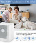Woman using laptop with child and dog next to vacuum bag packaging for Automated Dirt Disposal, i7, j7, i8, s9 series