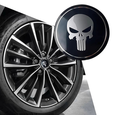 Badass American Flag Wheel Hub Cap Kit 4 Pack Slick Metal Center Hub Covers Legit Tough Waterproof Emblem Sticker For Truck Suv And Daily Driver Accessories close-up of a stylish wheel hub cap with a skull design on a modern alloy wheel.