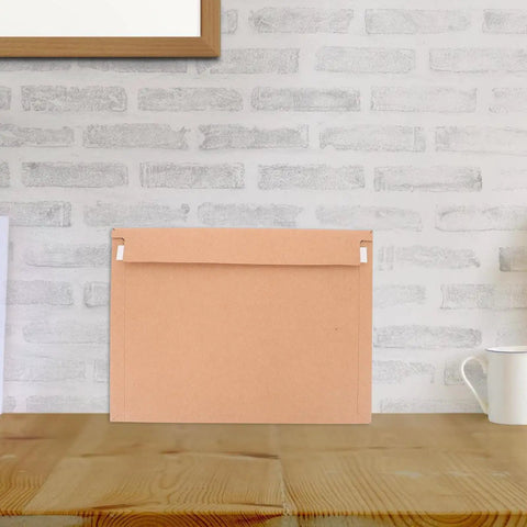 A4 Self Sealing Kraft Brown Envelopes Pack Of 30 Thickened Flat Cardboard Mailers with secure seal on table