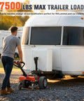 Man using Super Duty Electric Trailer Dolly with 6 Wheels boosting 7500 max load for RVs on gravel terrain.