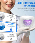 Person holding Ultrasonic Retainer Cleaner Pod With 48kHz Deep Cleaning Pro Grade, highlighting effective 48kHz technology.