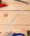 Heavy Duty T Shaped Socket Wrench 10Mm Hex Bit Driver on wooden surface among tools for garage use.