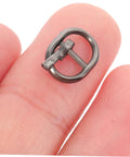 Close-up of alloy single prong belt fastener from Handy Mini Buckle Sewing Kit 150 Piece Set for Doll Clothes and DIY Craft Projects.