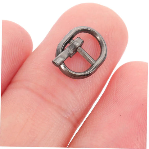 Close-up of alloy single prong belt fastener from Handy Mini Buckle Sewing Kit 150 Piece Set for Doll Clothes and DIY Craft Projects.