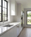 Modern kitchen with chrome pull-down kitchen faucet with two-function sprayer, single hole mount, sleek one-handle design.