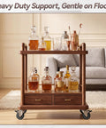 Heavy Duty One Inch Low Profile Caster Wheels With Brakes Quiet As A Mouse Soft Rubber Swivel Casters For Furniture And Rolling Carts gliding on a wooden bar cart with bottles.