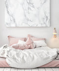 Cleo 1 Light Wall Sconce With Plug-In Or Hardwire Setup, Blush Pink Finish With Matte Brass Accents next to bed in bright bedroom