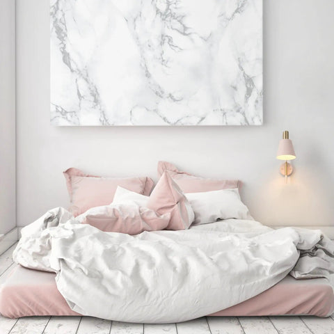 Cleo 1 Light Wall Sconce With Plug-In Or Hardwire Setup, Blush Pink Finish With Matte Brass Accents next to bed in bright bedroom