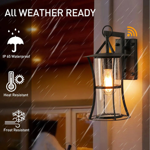 Dusk To Dawn Matte Black Outdoor Wall Light With Seed Glass, waterproof lantern shown illuminated in rain