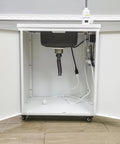 Underside view of Portable Mobile Hand Wash Station With Hot Water And Temperature Control Self Contained Sink Unit 24x18x39 Inches 110V Power Ideal For Schools Labs Clinics Hospitals Food Trucks Festivals showing pipes and wiring.
