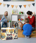 Rock Solid Rectangular Storage Basket With Handles For Shelf Organization Hella Durable Waterproof Oxford Cloth Dope Cartoon Owl Design in children's playroom.