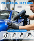 Man using Powerful 1800W Heat Gun For Crafting With Adjustable 122F To 1202F Temperature on blue car, nozzles visible.
