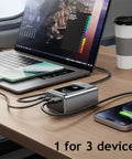 Rugged 35 Watt Fast Charging Power Battery Case With Type C And Usb Ports For Phones Laptops charging three devices on a table.