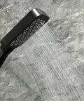 Upgrade Your Bathroom with This Matte Black Handheld Shower System - close-up of high-pressure spray and silicone nozzles.