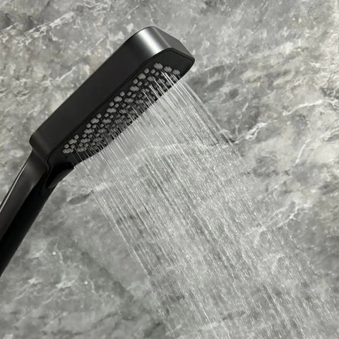 Upgrade Your Bathroom with This Matte Black Handheld Shower System - close-up of high-pressure spray and silicone nozzles.