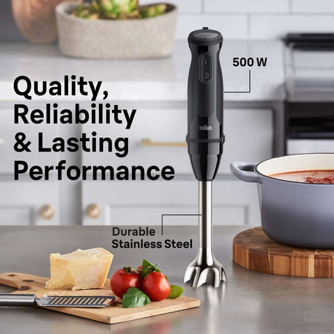 Professional Hand Blender With Turbo Boost And Powerbell Plus Tech For Ultra Smooth Purees And Creamy Soups A Hella Efficient Kitchen Workhorse Making Mealtimes A Breeze 500W on kitchen countertop next to vegetables.