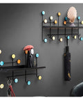 Top Shelf Wrought Iron Double Wall Hooks For Coats And Gear Rustic Entryway Organizer with colorful round decor and umbrella holder.