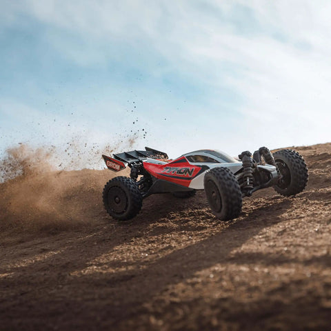GROM 4x4 Smart Small Scale RC Buggy RTR with Battery and Smart Charger Red White on dirt hill, kicking up soil.