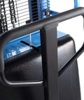 Close-up of the handle on the Semi Electric Pallet Stacker Straddle Forklift with adjustable forks designed for tight aisles.