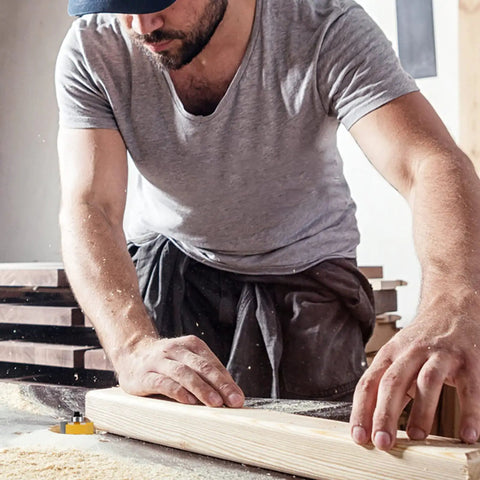Woodworker using Quarter Inch Shank Rabbet Router Bit With Six Bearings Built Tough For Smooth Clean Rabbets carbide tipped on wood