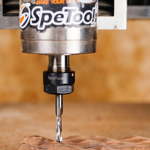 SpeTool router bit, carbide, 1/4 in shank and 1/4 in cutting diameter, installed in router cutting wood