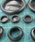 Tough As Hell 50Mm One Sided Rubber Wire Grommet Gasket Kit Plus O Rings For Fast Wire Passes Shielding Sharp Metal Edges From Chafe Damage In Diy Auto Marine Body Panel Work Ensuring Cables Stay Secure And Safe Forever. 50mm black rubber grommets on cutting mat