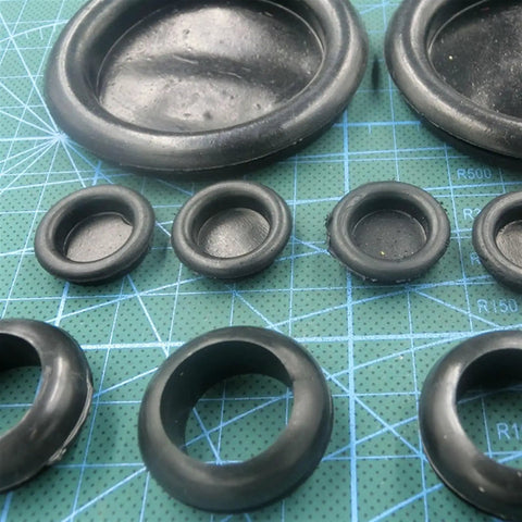 Tough As Hell 50Mm One Sided Rubber Wire Grommet Gasket Kit Plus O Rings For Fast Wire Passes Shielding Sharp Metal Edges From Chafe Damage In Diy Auto Marine Body Panel Work Ensuring Cables Stay Secure And Safe Forever. 50mm black rubber grommets on cutting mat
