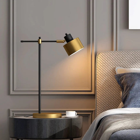 Mid Century Modern Desk Lamp With Matte Black Finish And Gold Accent on nightstand in bedroom, 22.25 inch table light