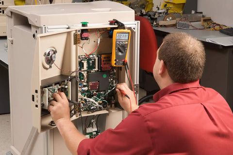 Technician using Industrial Electronics Multimeter Combo Kit With Probes And Hooks Six Piece DMM Set for Troubleshooting