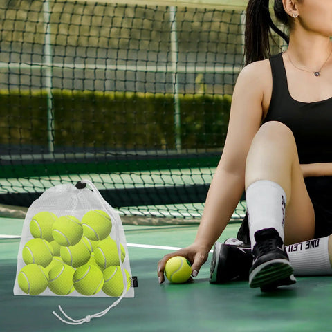 Woman on tennis court with 3 Pack Mesh Ball Bags Set Nylon Drawstring Organizer Bags 10x11.5 Inches holding tennis balls next to her