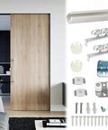 Premium Heavy Duty Aluminum Barn Door Rail Set with sliding track and rollers beside a wooden barn door in a modern interior.