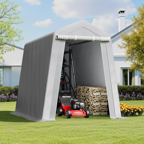 Heavy-Duty Portable Outdoor Storage Shed Tent 6x8x7 Ft With Roll-Up Zipper Door in a backyard, storing a lawn mower and wood