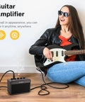 Woman playing electric guitar with Portable 5W Mini Guitar Amp For Practice Jam Ready Compact Electric Guitar Amplifier
