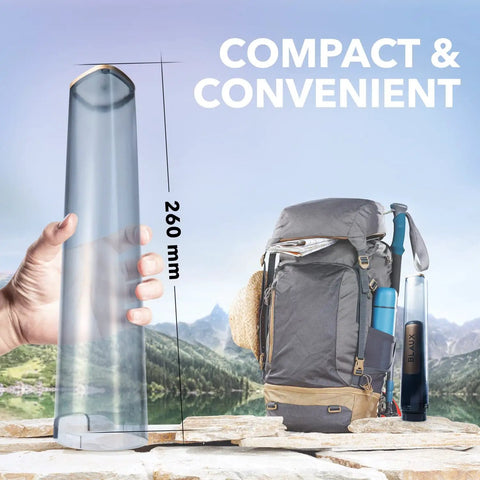 Hand holding XL Portable Bidet Water Chamber Extension Tank 290mL Capacity beside backpack, showcasing travel readiness.