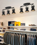 Three Light Black Track Lighting Kit With Rotatable Heads ceiling light in modern closet setting