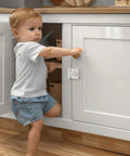 Solid Keyless Cabinet Lock With Three Digit Combo For Sliding Doors And Drawers Featuring Anti Pry Bar And No Sweat Install White Finish and child using cabinet.