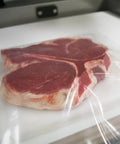 Raw steak in Chamber Vacuum Pouches 3 Mil Thick, 10 x 13 Inches, BPA Free Pre Cut Bags With Tear Notch for sealers.