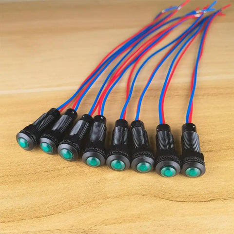 Green LED Indicator Pilot Light Kit For Panels 110VAC 8mm Mounting Hole Flame Retardant Plastic Shell 8 Pieces For Clear Status Signals And Emergency Alerts Easy To Install In Industrial Control Panels For Clear Status Alerts And Quick Diagnostics. Eight green panel pilot lights with red and blue wires.
