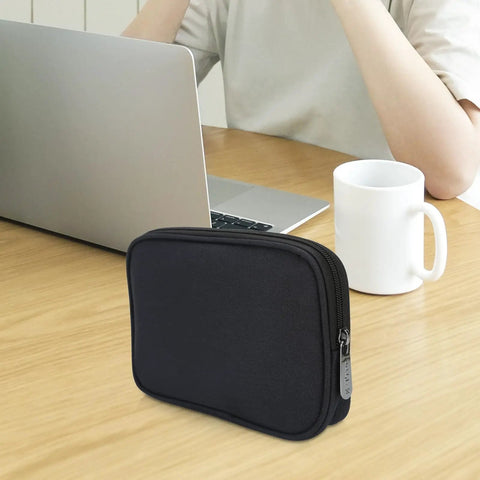 Compact Grab And Go Travel Case Organizer for Small Electronics and Accessories on a wooden table