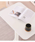Built Different Overbed Table With Adjustable Height For Bedside Care And Work From Home Vibes with magazine and coffee cup.