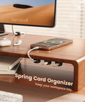 Wooden desk with smartphone on top, cables organized under using 6 Pack Small Cable Clips For Desk And Nightstand - Compact Adhesive Wire Organizer With 8mm Slots, Cord Holder, And Desk Cable Management Clips - Easy Mount To Keep Cables Tidy At Office Or Home.