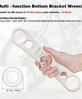 Hand holding Multi Function Bottom Bracket Wrench Pro Grade Tool For 39 40 Point 5 44mm Outer Diameter 16 Notch Fits Shimano BB Series And SRAM GXP Bikes Be Your Go To Fix For Home Or Pro Shop Maintenance.