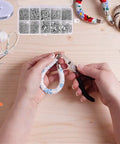 Hands using pliers from the All In One Jewelry Making Kit With Pliers, Findings, Beading Wires And Repair Tools For Adults And Beginners