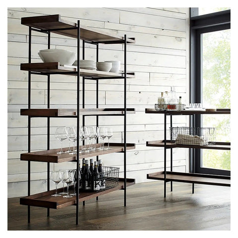 Built Different Heavy Duty Black Iron Bookshelf With Real Wood Shelves Industrial Floor Standing Storage Rack For Living Room Setup Home Office Display Organizer showcasing solid wood shelves with glassware and bottles.