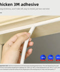 Hand applying Weather Stripping For Doors And Windows With Self Adhesive Backing, Easy Cut To Size, White 18 Feet corner sealing.